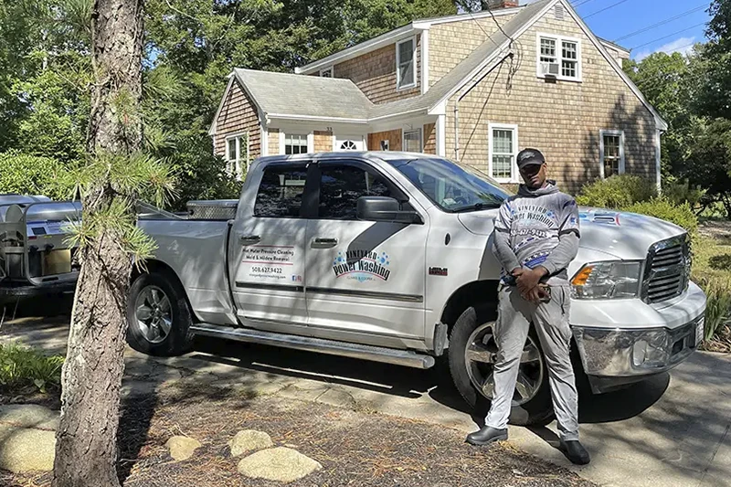 Vineyard Washing representative worker in front of the vehicle