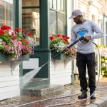 Commercial pressure washing service cleaning a historic Edgartown Martha's Vineyard storefront facade