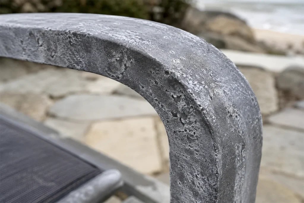 Salt air corrosion on aluminum patio furniture frame near Martha's Vineyard harbor