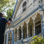 Soft washing a painted gingerbread cottage exterior in Oak Bluffs Martha's Vineyard